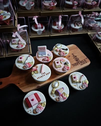 Nephele Cupcake Art classic vanilla cupcakes with beauty-themed fondant decorations